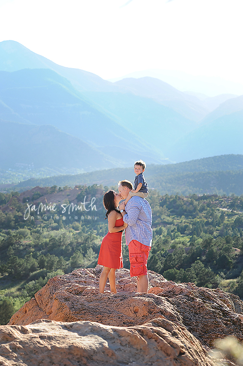 adorable family on top of large rock