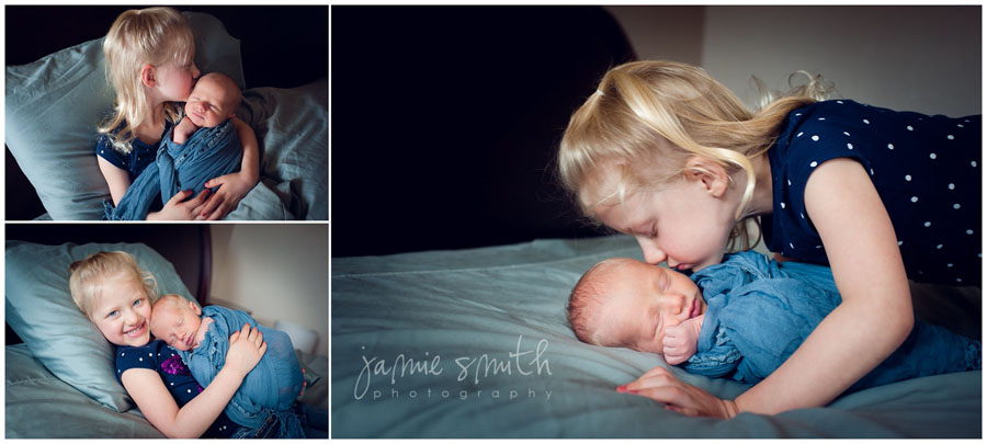 big sister loving on baby brother