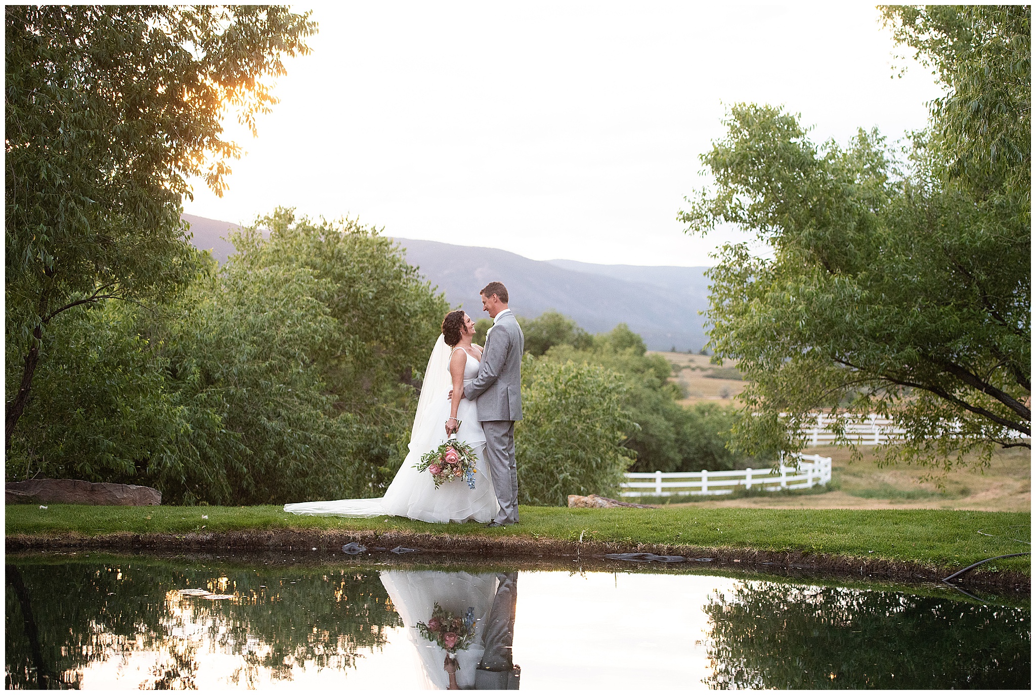 bride and groom standing near the lake at Crooked Willow Farms Wedding venue