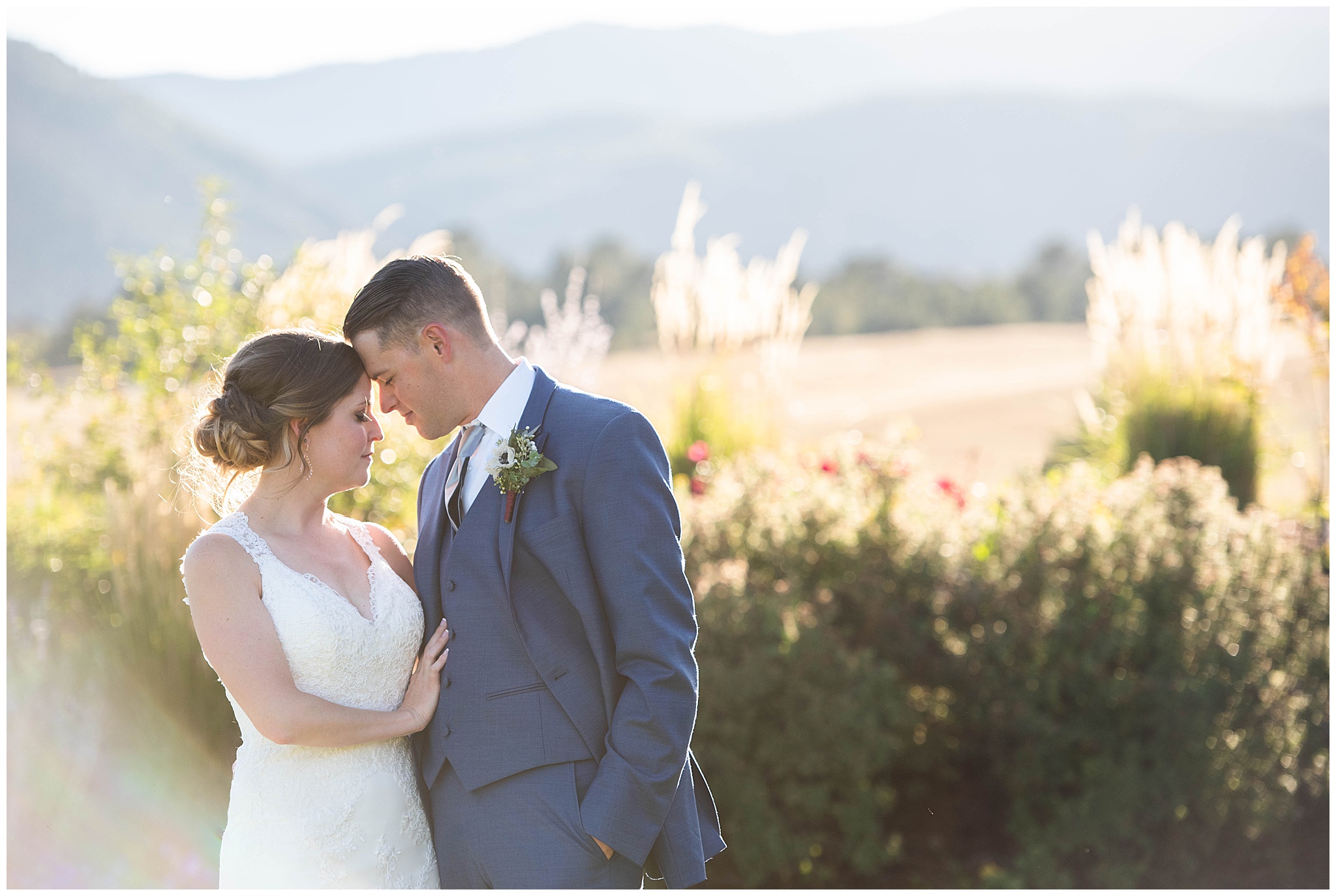 couple with their foreheads touching in a field at Crooked Willow Farms Wedding venue
