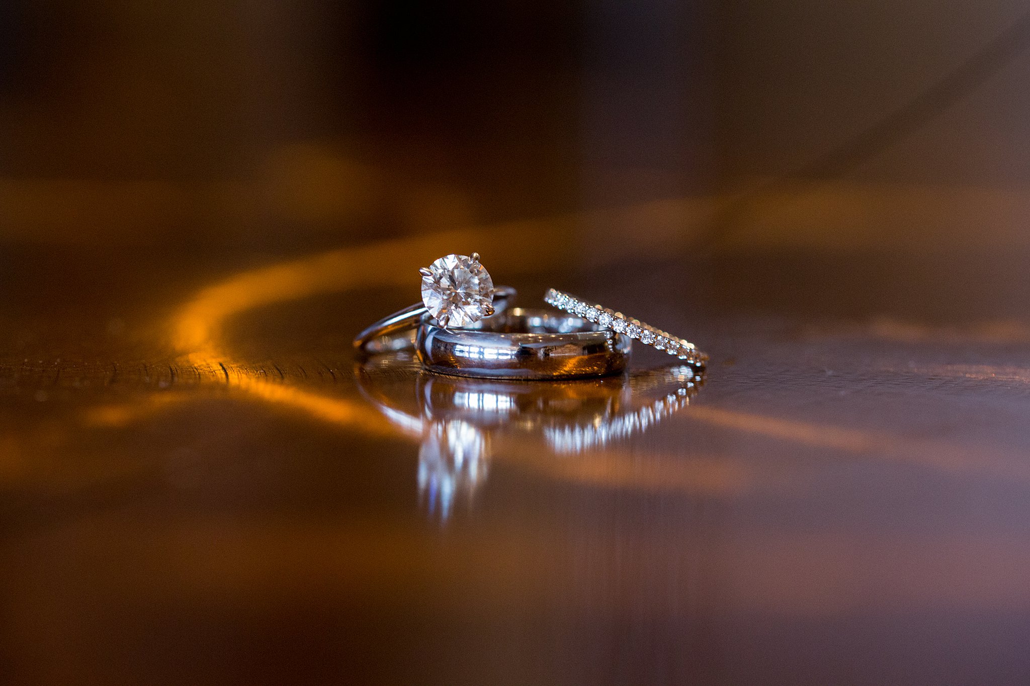 details of wedding rings on a table heath house venue