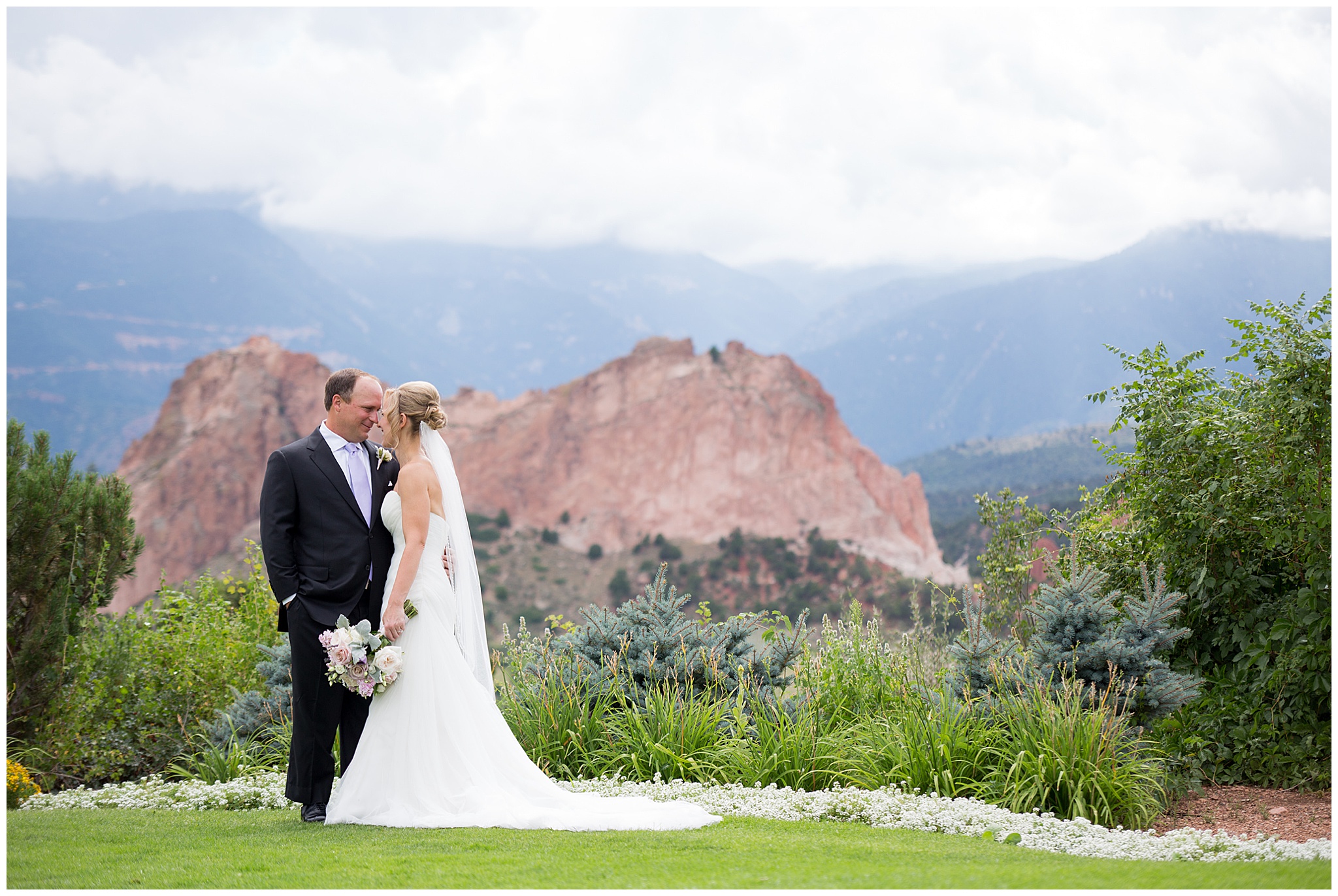 bride and groom looking at each other at the garden of the gods club wedding venue