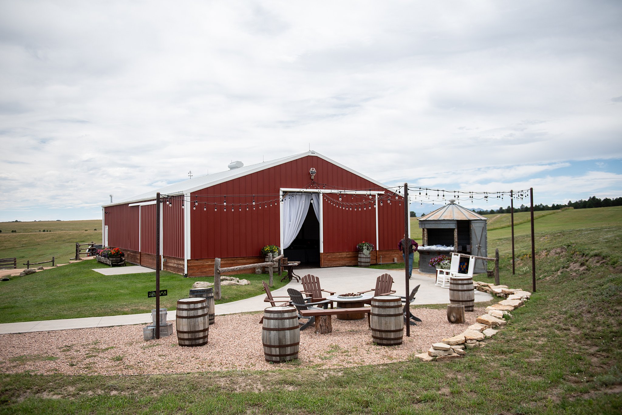 Details of a wedding reception patio outside a barn