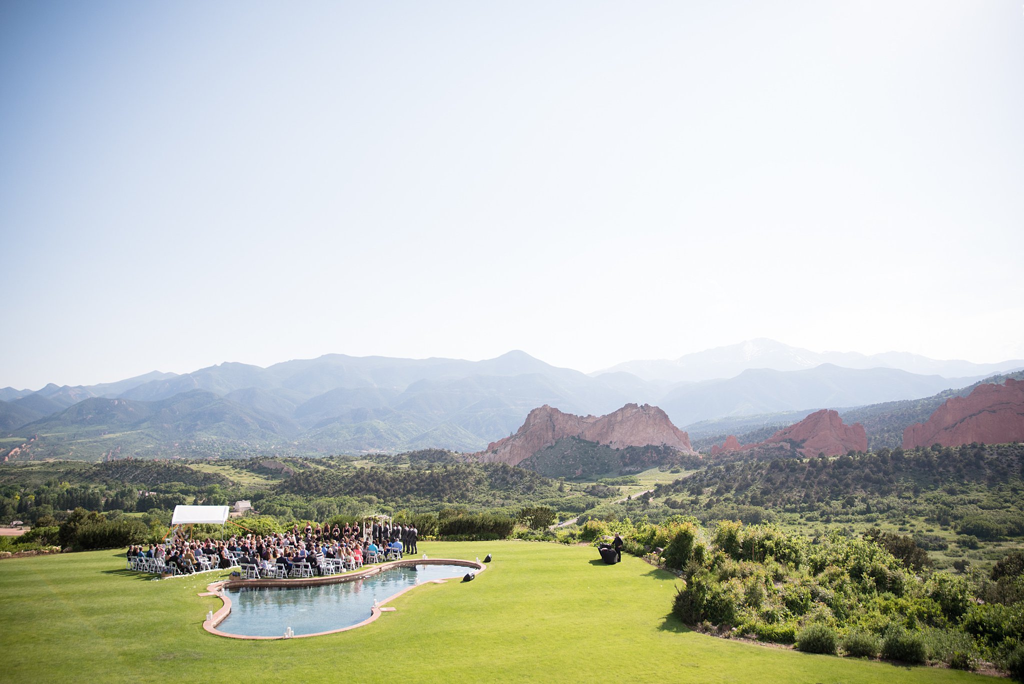 A look at the epic landscape during a Garden Of The Gods Club Wedding ceremony by the pool