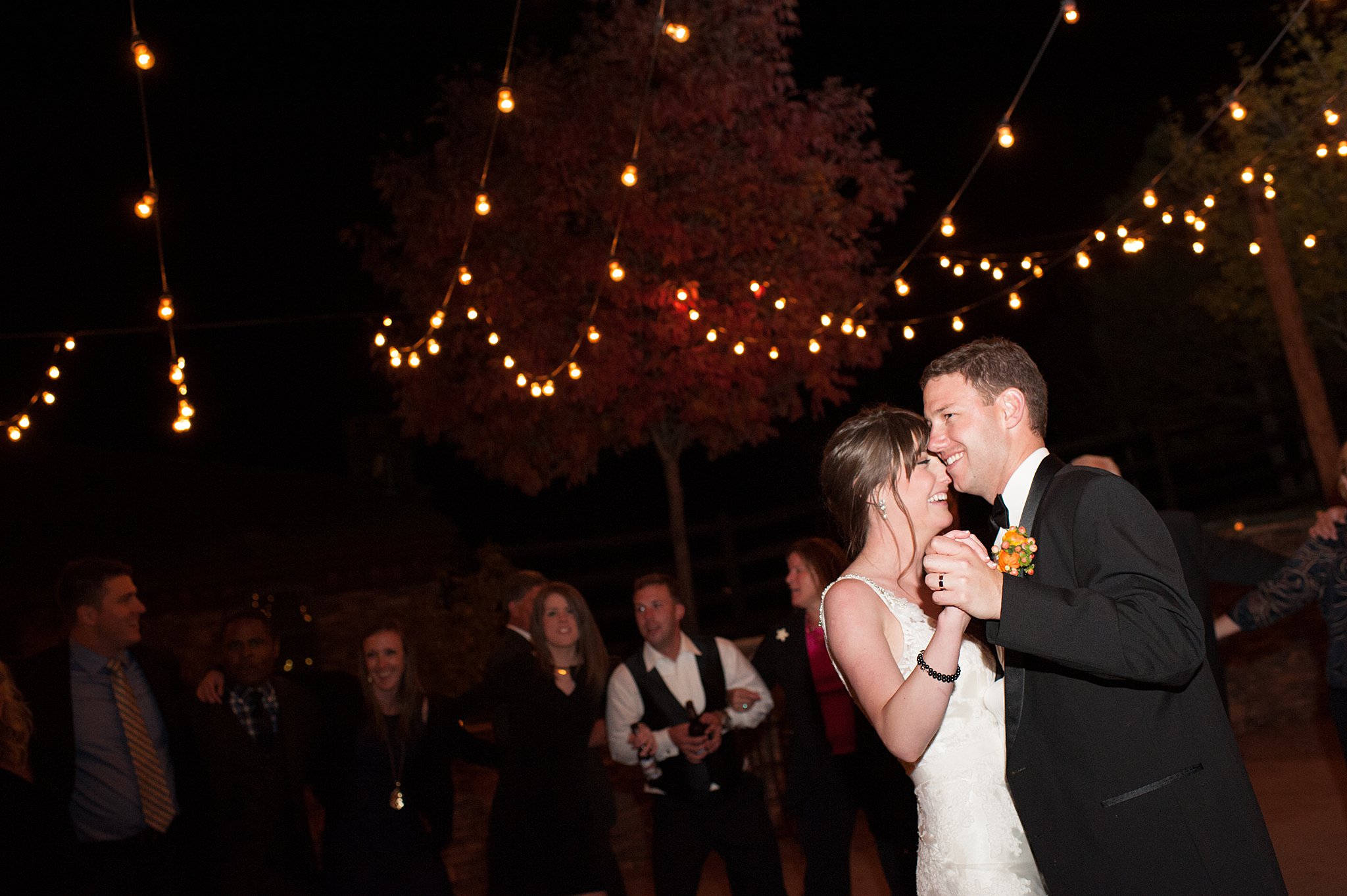 Newlyweds laugh and dance for the first time at their Spruce Mountain Ranch wedding