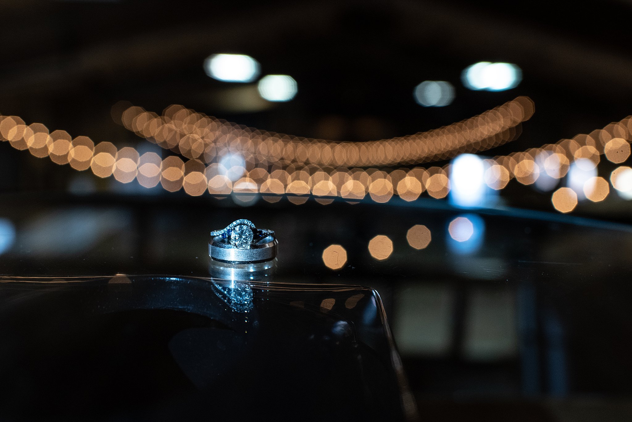 Details of wedding bands on a clear table