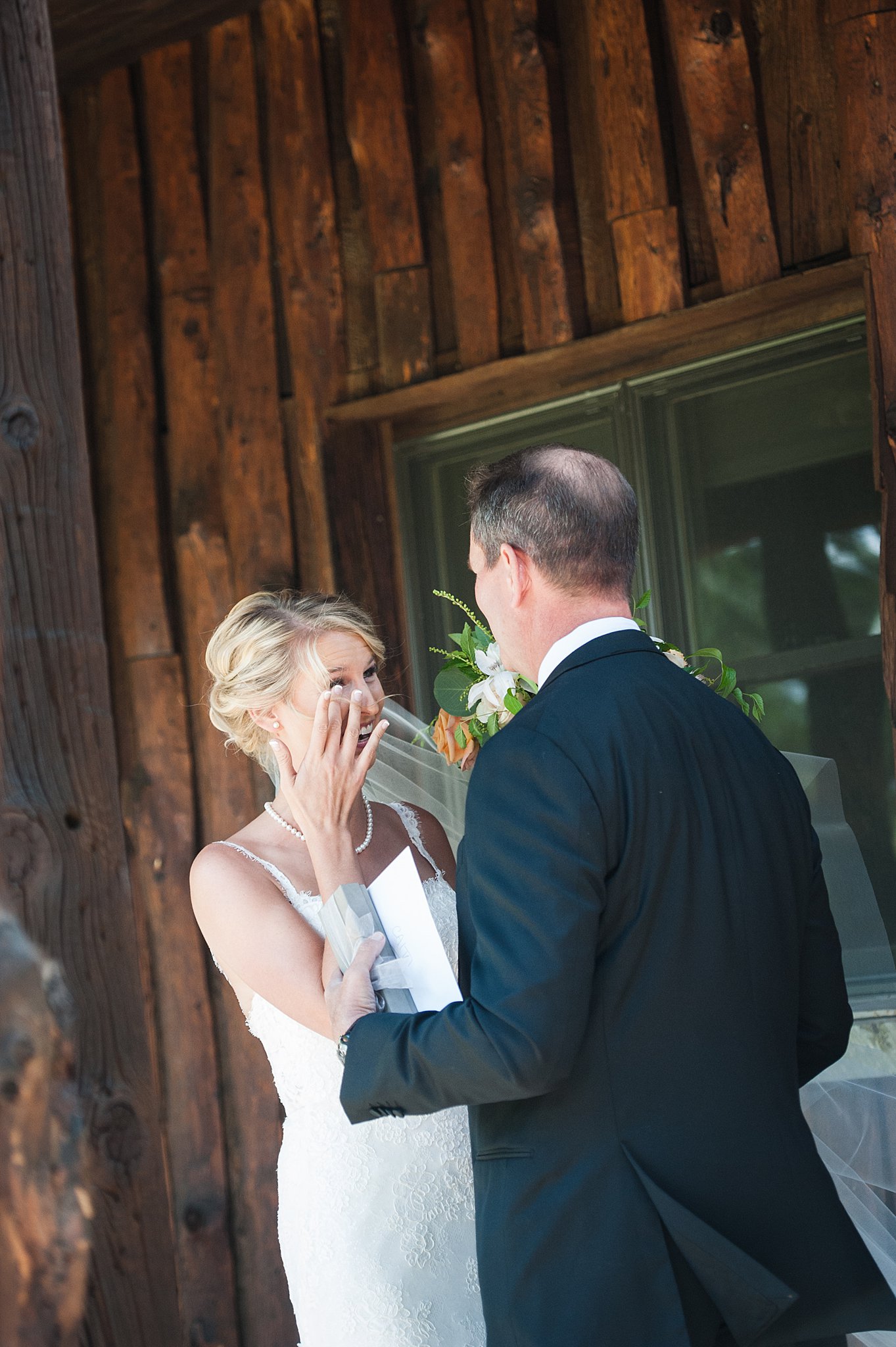 A bride cries as her father sees her for the first time